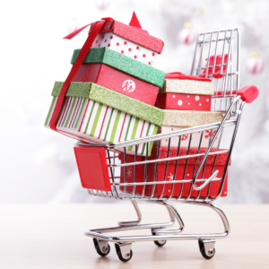 Photo of a shopping cart  full of gift boxes wrapped in red, white, and green paper