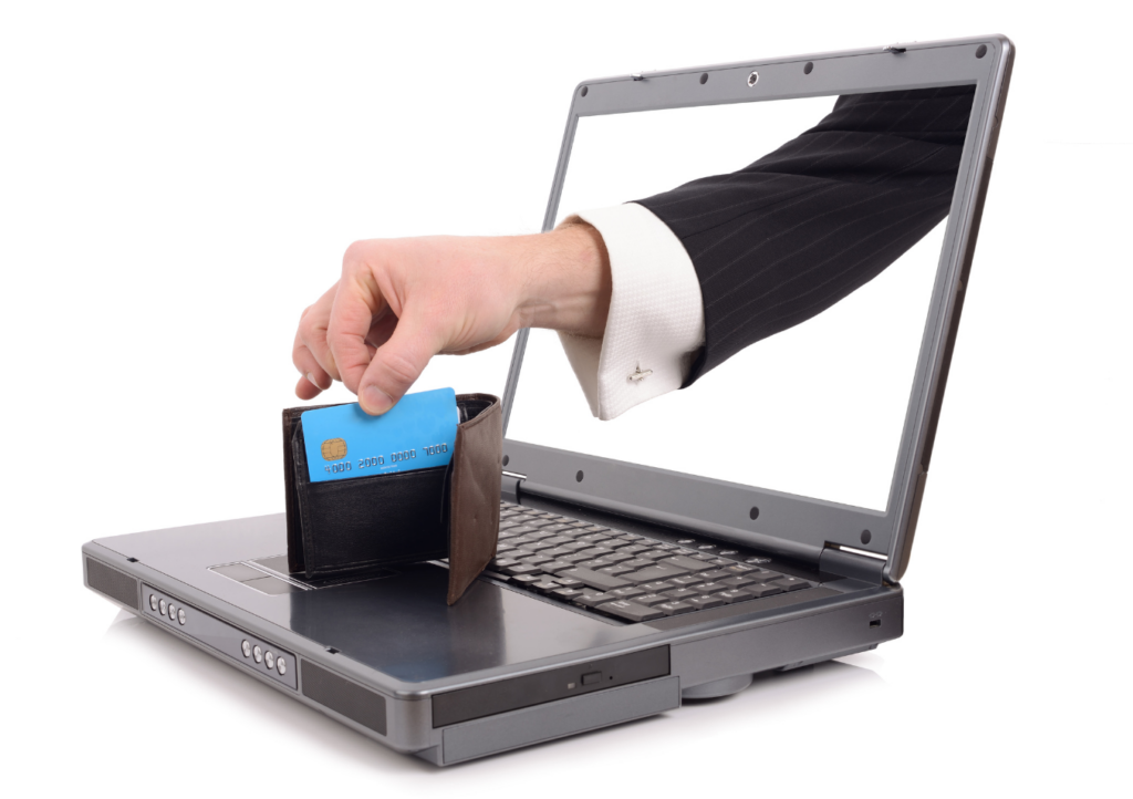 a hand coming through the screen of a laptop, taking a credit card out of a wallet that is sitting atop the laptop keyboard